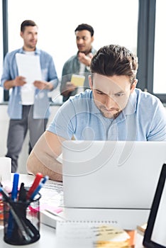 Casual businessmen working on new project at modern office