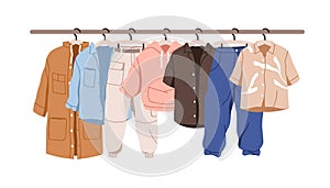 Casual clothes hanging on rack. Garments row on hanger rail. Modern wardrobe, wearing for charity. Different women