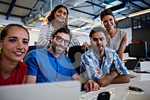 Casual colleagues smiling at camera