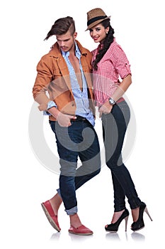 Casual couple with man looking down