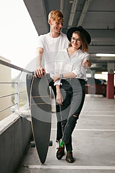 Casual Fashion Clothing. Young Couple In Stylish Clothes Indoors