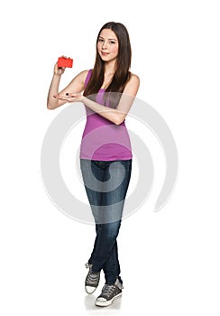 Casual female showing blank credit card