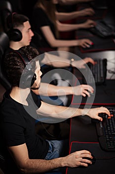 Casual gamers gather together in pc gaming club to compete in online tournament