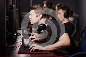 Casual gamers gather together in pc gaming club to compete in online tournament