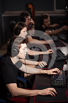 Casual gamers gather together in pc gaming club to compete in online tournament