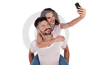 Casual happy couple taking a selfie picture with their phone