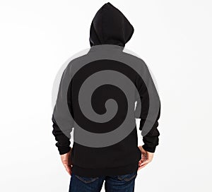 Casual image of caucasian male wearing a black hoodie, photographed in studio. Black sweatshirt mockup