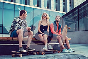 Casual longboarders posing in a town.