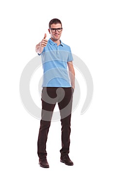 Casual man with hand in pocket shows ok sign