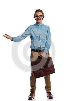 Casual man holding briefcase and greeting