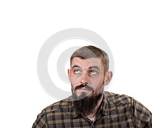 Casual man looking up to blank space over white background