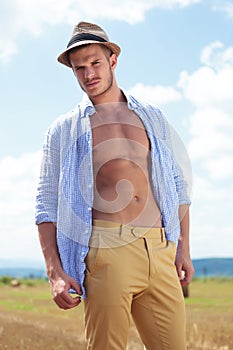 Casual man outdoor with shirt unbuttoned
