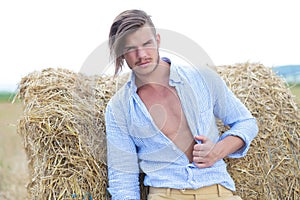 Casual man outdoor with unbuttoned shirt