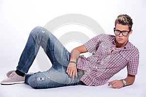 Casual man serious on the floor