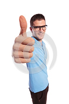 Casual man shows you the thumb up
