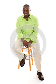 Casual Man Sitting On Stool