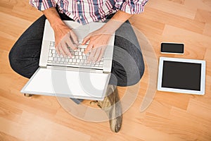 Casual man sitting and working with laptop