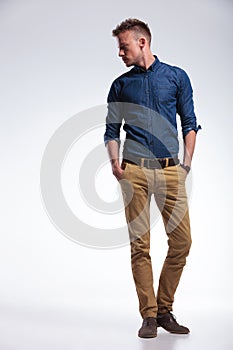 Casual man standing with both hands in pockets