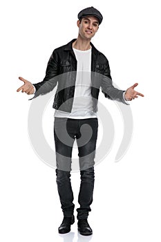 Casual man standing with open arms cocky photo