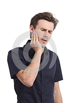 Casual man suffering toothache with hand pressing on face