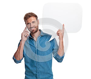 Casual man talking on the phone and holding speech bubble