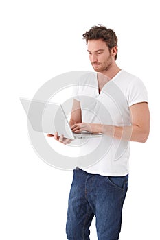 Casual man using laptop