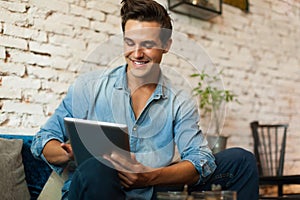 Casual Man Using Tablet Computer Smile