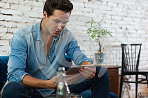 Casual Man Using Tablet Computer Smile