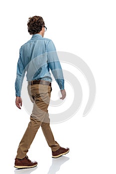 Casual man walking and minding his own business