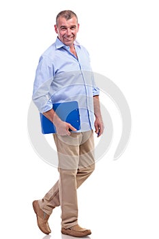 Casual middle aged man holding his clipboard