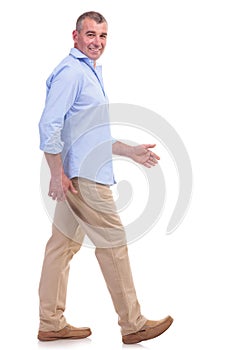 Casual middle aged man stepping forward