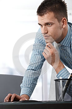 Casual office worker using computer