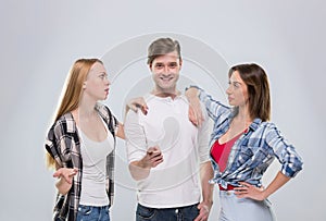 Casual People Group, Young Man Two Woman Happy Smile Handsome Guy Beautiful Girls Point Finger To You Talking