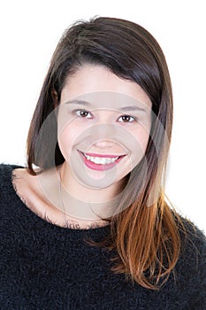 Casual portrait of a smiling young woman looking at camera and laughing