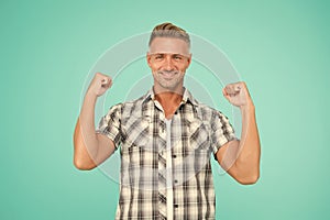 Casual and powerful. Strong guy flex arms blue background. Handsome man in casual style. Casual fashion trends. Fashion