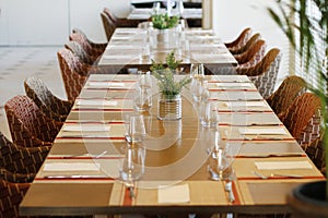 Casual restaurant dining table set up, with dark wooden color theam