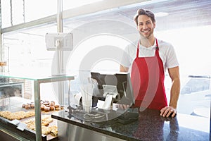 Casual server posing behind the counter