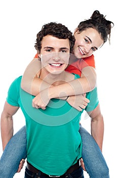 Casual shot of young guy giving piggy ride