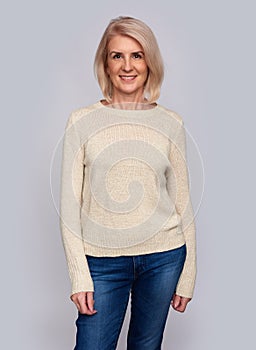 Casual smiling pretty old woman isolated