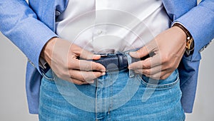 Casual style of man, closeup. Male accessory for man in menswear. Jeans belt. Menswear for man wearing jeans and belt