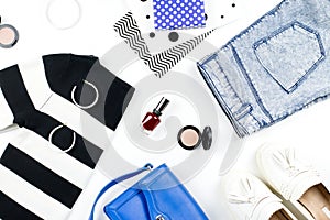 Casual style woman clothes and fashion accessories flat lay. Trendy patterns and prints concept. Top view