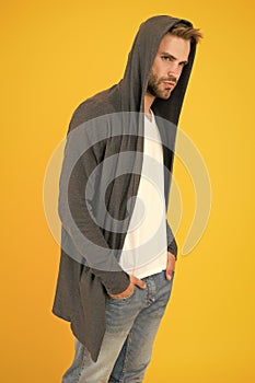 Casual but stylish. Stylish man yellow background. Handsome guy wear stylish hoodie. Fashion trends for young men