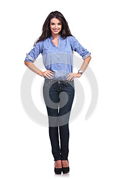 Casual woman with both hands on hips