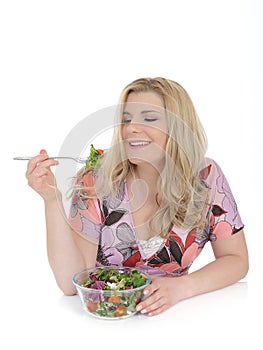 Casual woman eating healthy vegetable salad