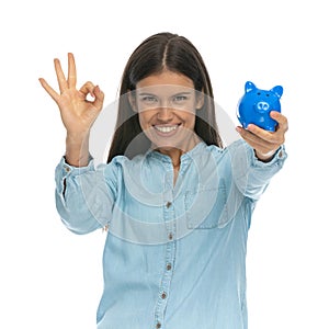Casual woman gesturing it`s ok to save money