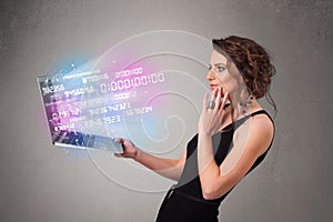 Casual woman holding laptop with exploding data and numers