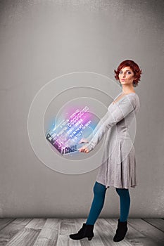 Casual woman holding laptop with exploding data and numers