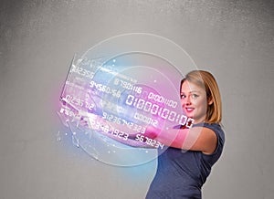 Casual woman holding laptop with exploding data and numers