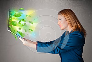 Casual woman holding notebook with recycle