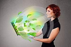 Casual woman holding notebook with recycle and environmental symbols